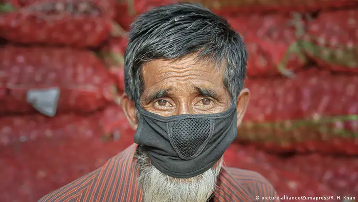 A man wears a mask in the streets of Sylhet, Bangladesh, as a preventive measure against the spread of the coronavirus